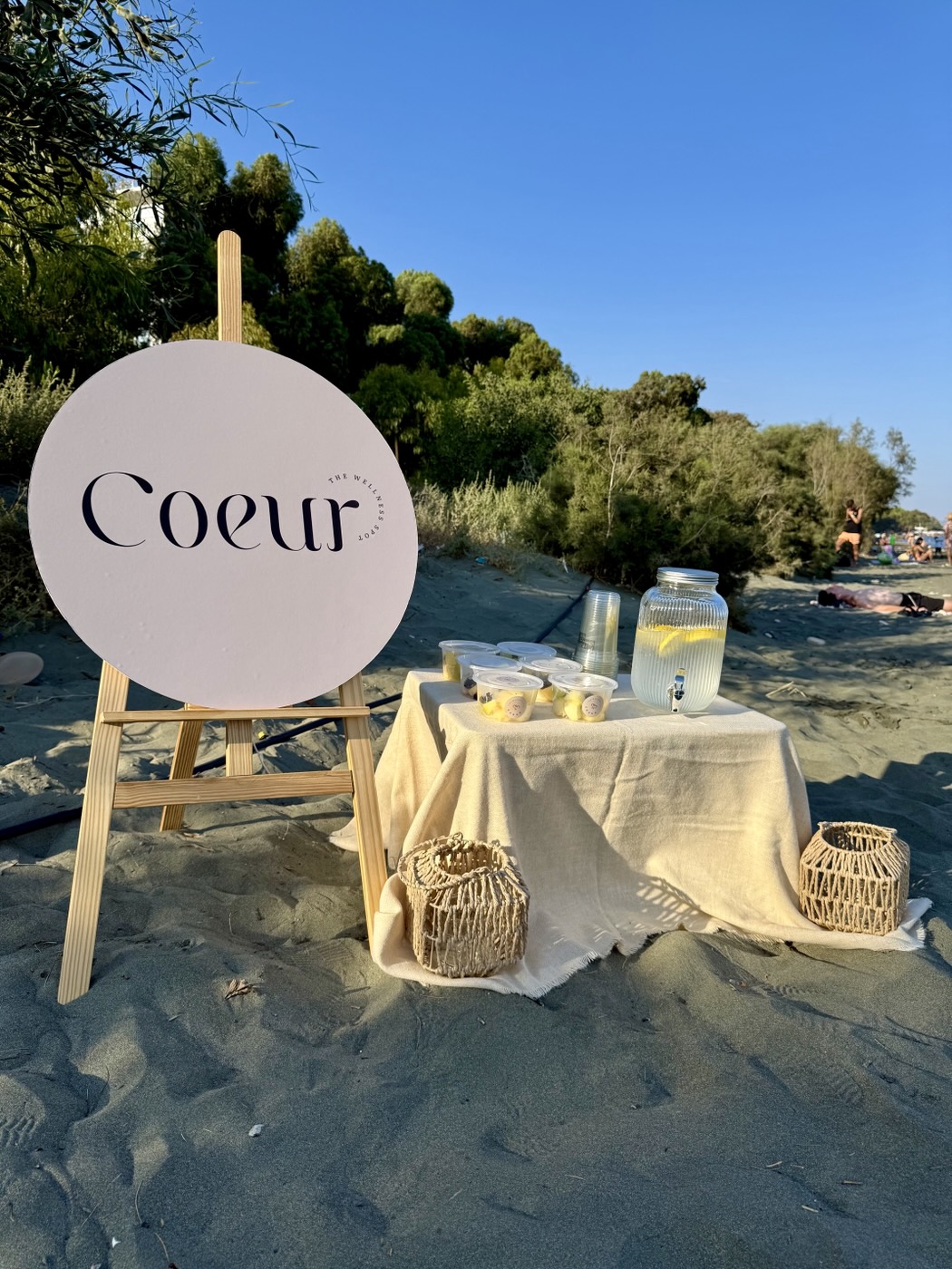 Coeur sign and refreshments table on the beach